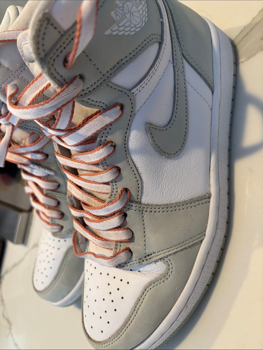 Jordan men’s High Top Sneakers in White and Light Gray with Coral-Trim Laces